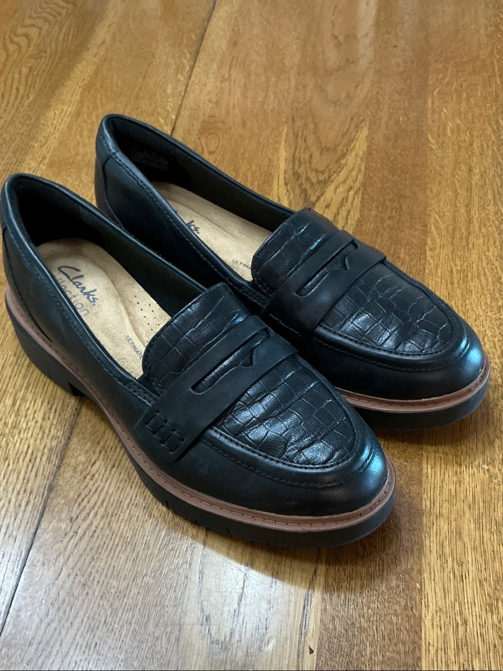 Woman’s Clarks black leather loafers. Size 6. Embossed leather on front.Like new